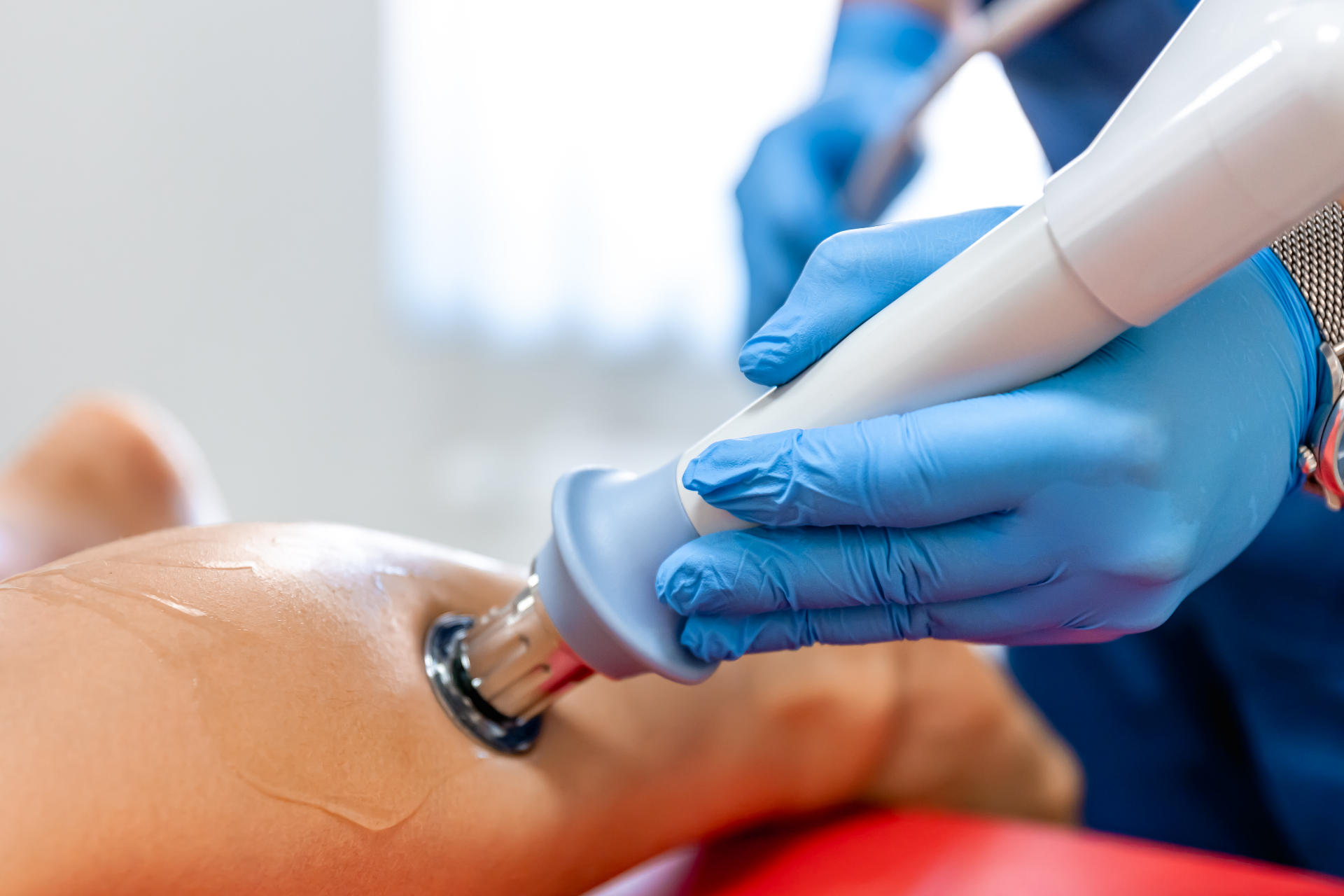 Close-up of shockwave therapy treatment