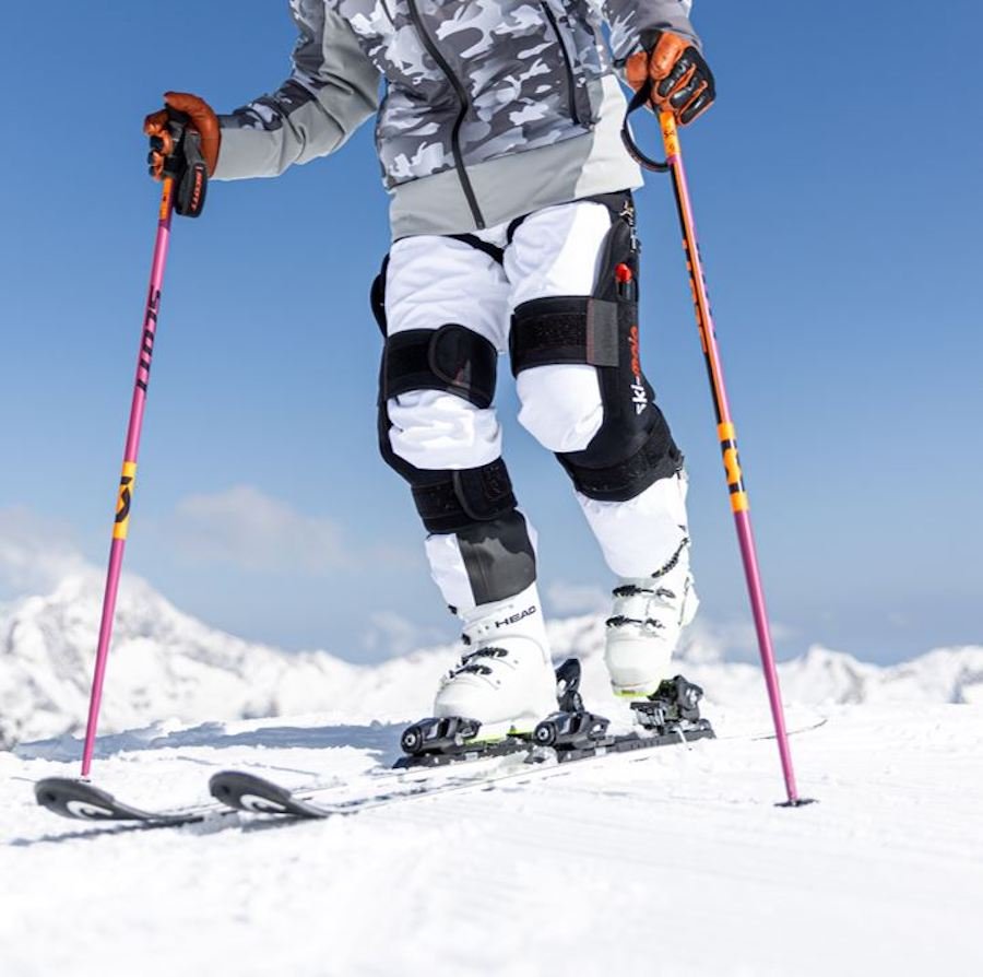 Skier wearing Ski-Mojo Silver exoskeleton on mountain slopes